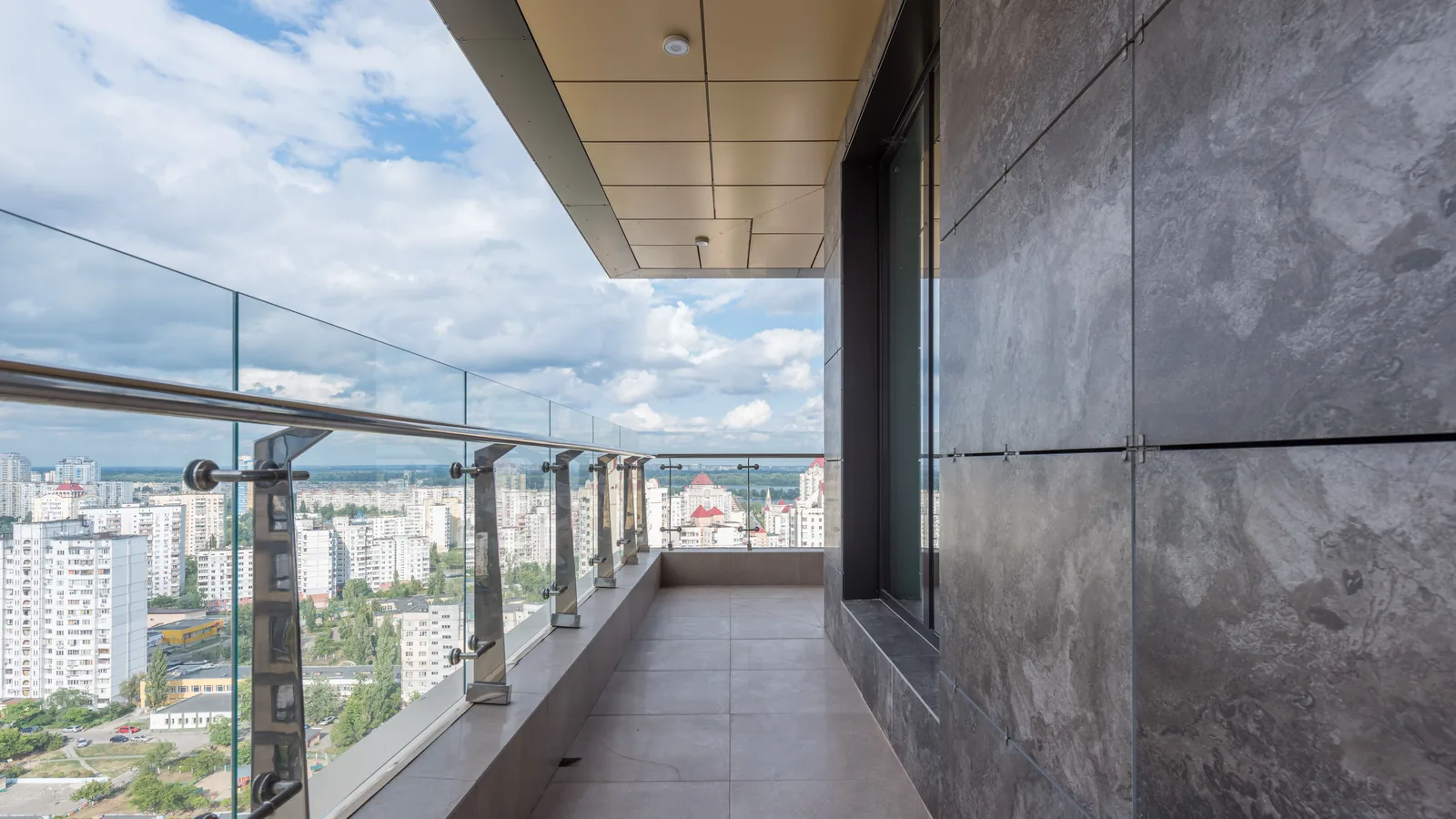 A glass rail on a high empty terrace